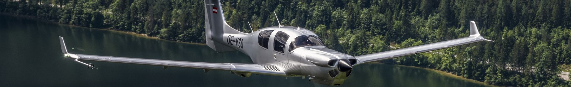 Airplane flies over lake